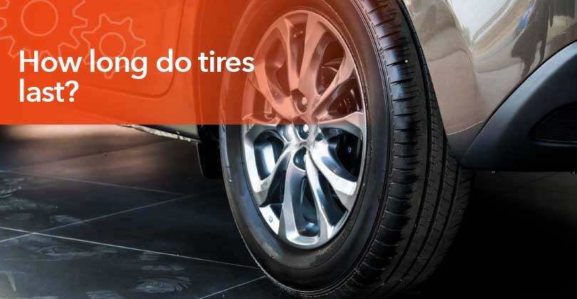 Worn vehicle tire showing tread wear indicators that signal the need for replacement.