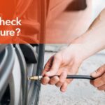 Checking tire pressure with a digital gauge to ensure proper vehicle safety and performance.