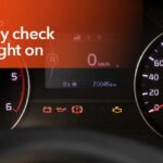 Car dashboard displaying a check engine light warning indicating a potential vehicle issue.
