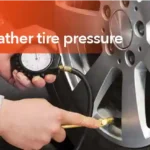 Technician checking car tire pressure during cold weather to ensure safe driving and proper tire